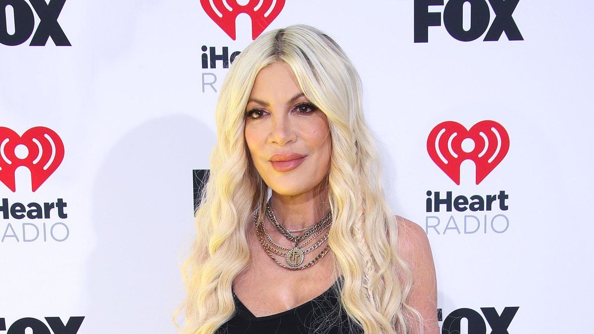 Ab-flashing Tori Spelling hits the red carpet as she's seen for FIRST time since filing for divorce from Dean McDermott at iHeartRadio Awards