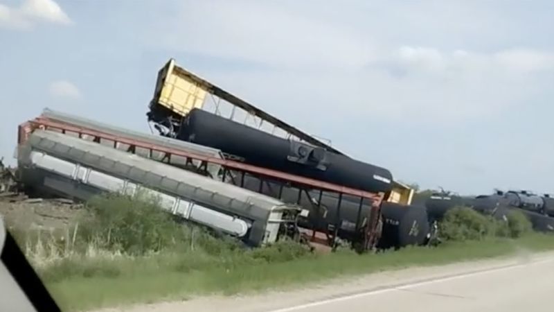 Derailment of train carrying hazardous materials in Minnesota closes highway, but there are no signs of leakage, officials say