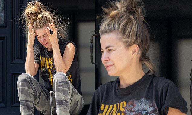 Carmen Electra goes make-up free as source DENIES claims the Baywatch star was 'distraught and upset' after sparking concern while squinting in the sunshine