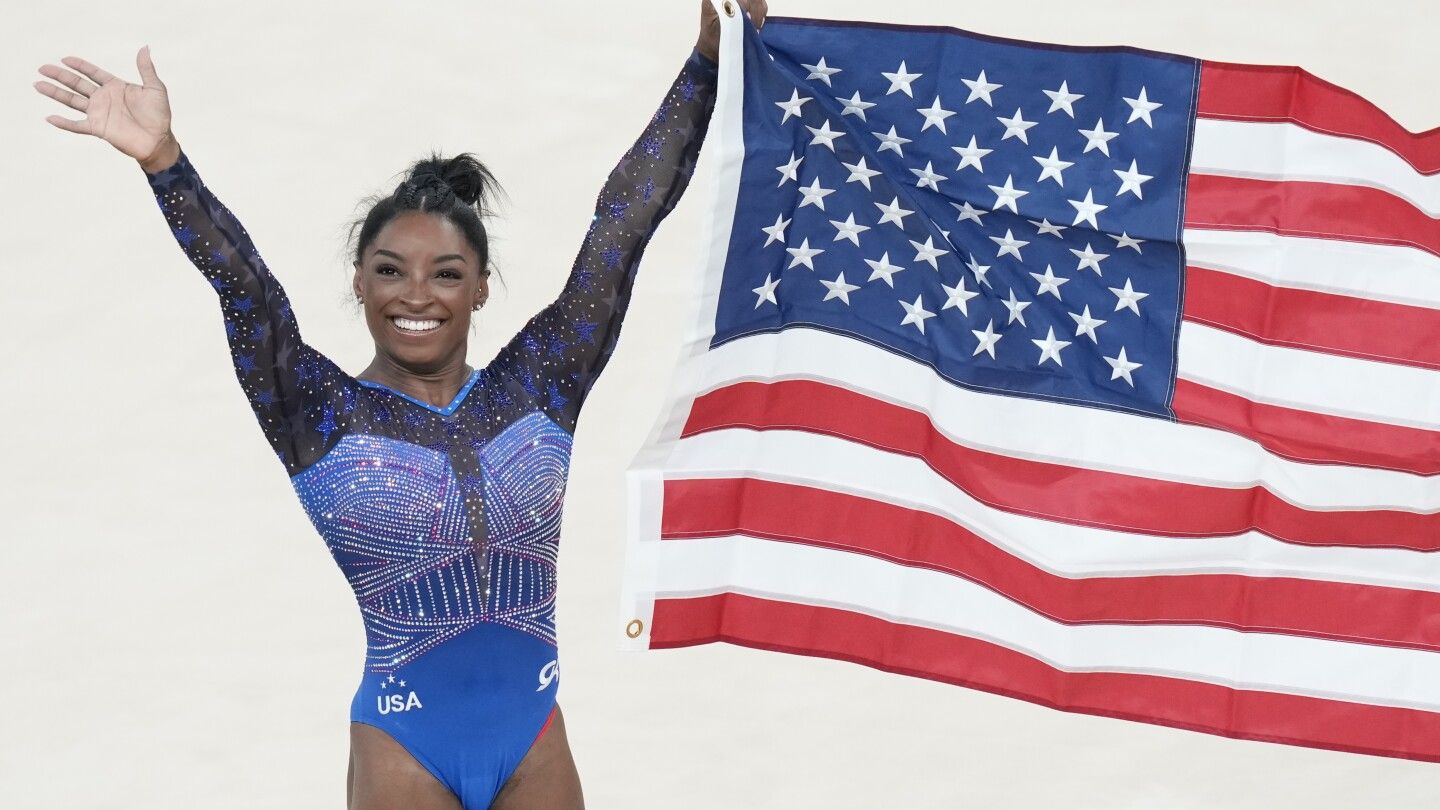 Simone Biles edges Brazil's Rebeca Andrade for her second Olympic all-around gymnastics title