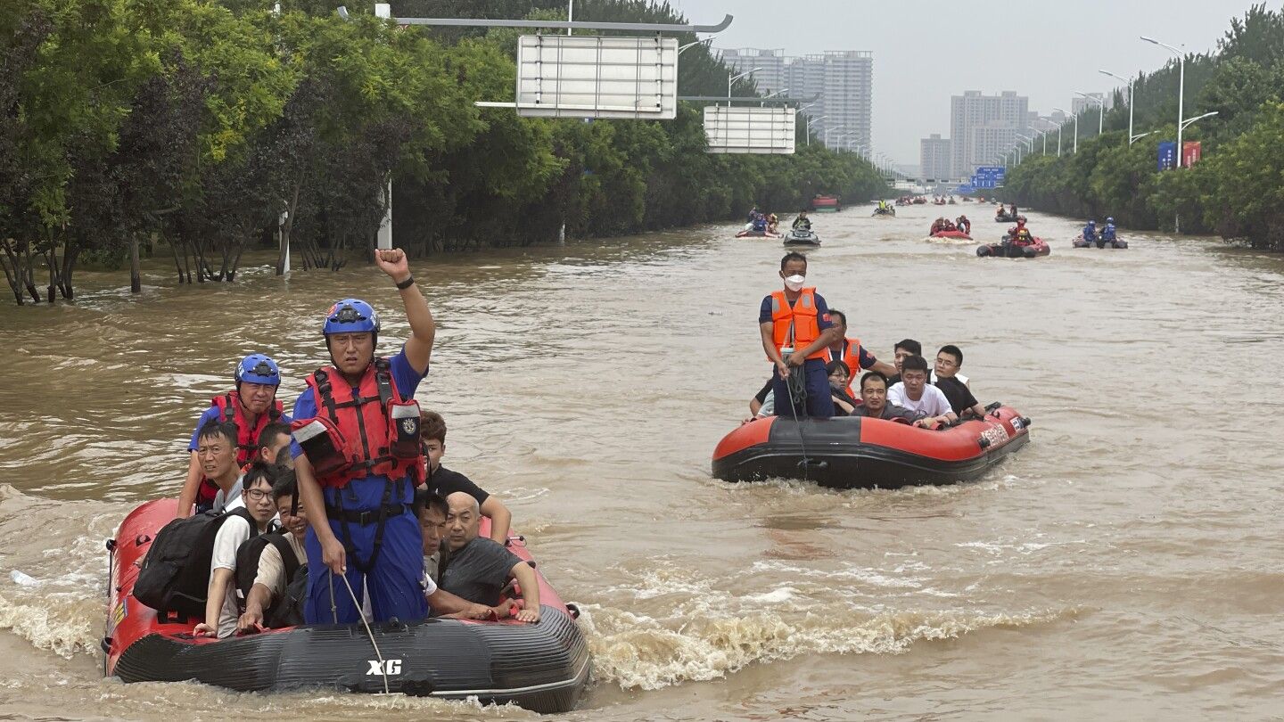 Beijing records heaviest rainfall in at least 140 years, causing severe flooding and 21 deaths