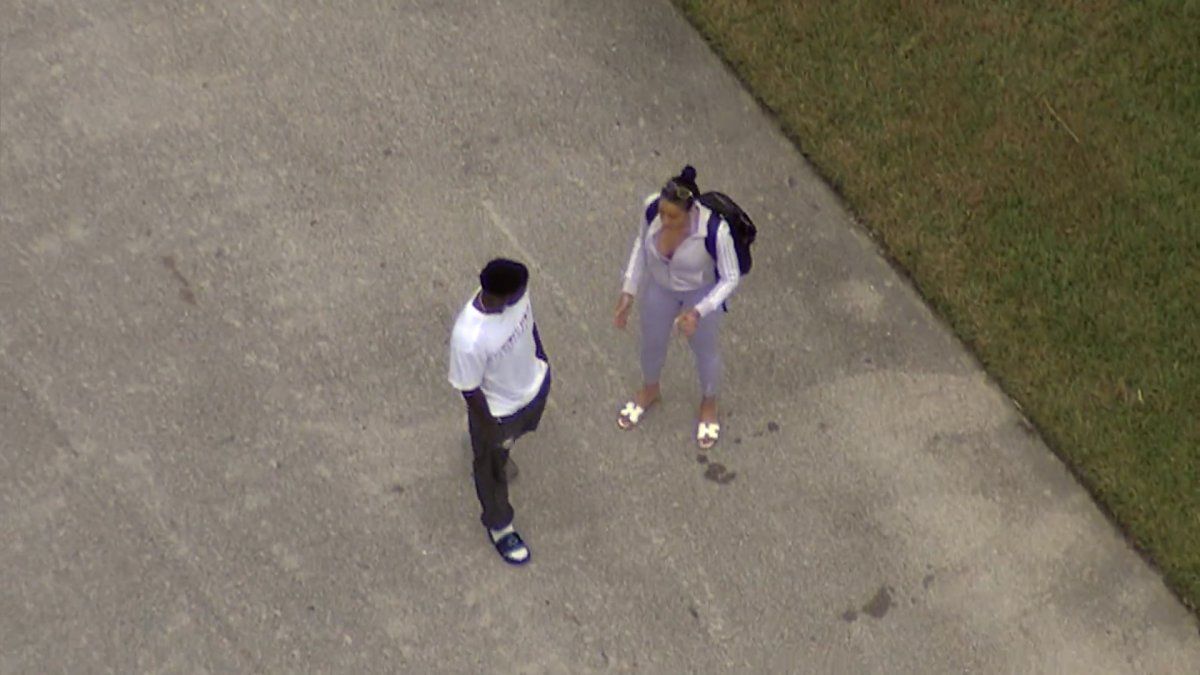 Tyreek Hill appears in a walking boot while checking out house fire