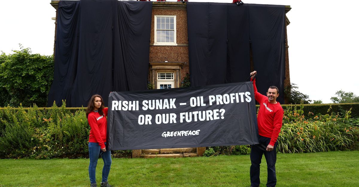 Protesters drape home of UK PM Sunak in black fabric over oil policy