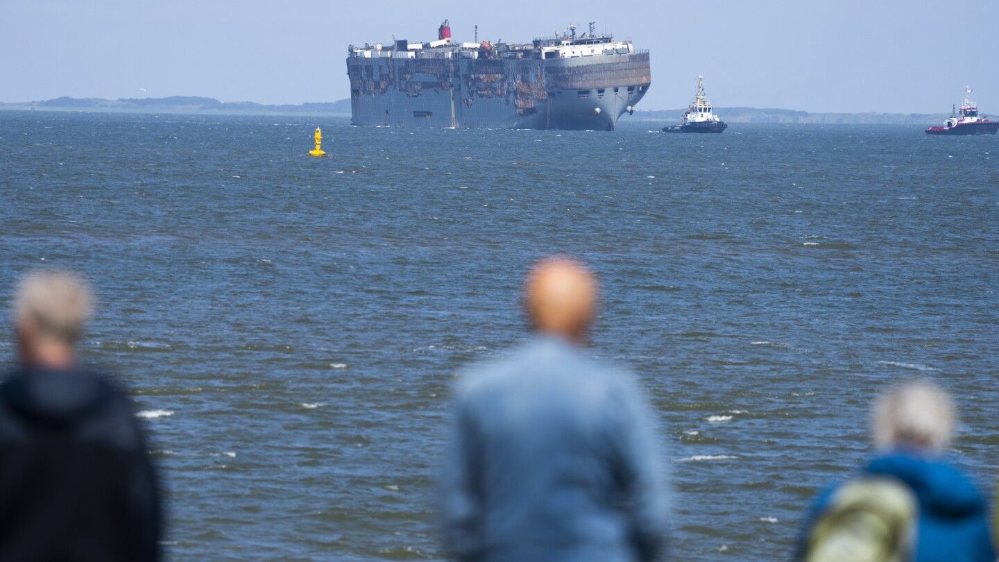 A car-carrying ship that burned for a week on the North Sea will be towed to a Dutch port