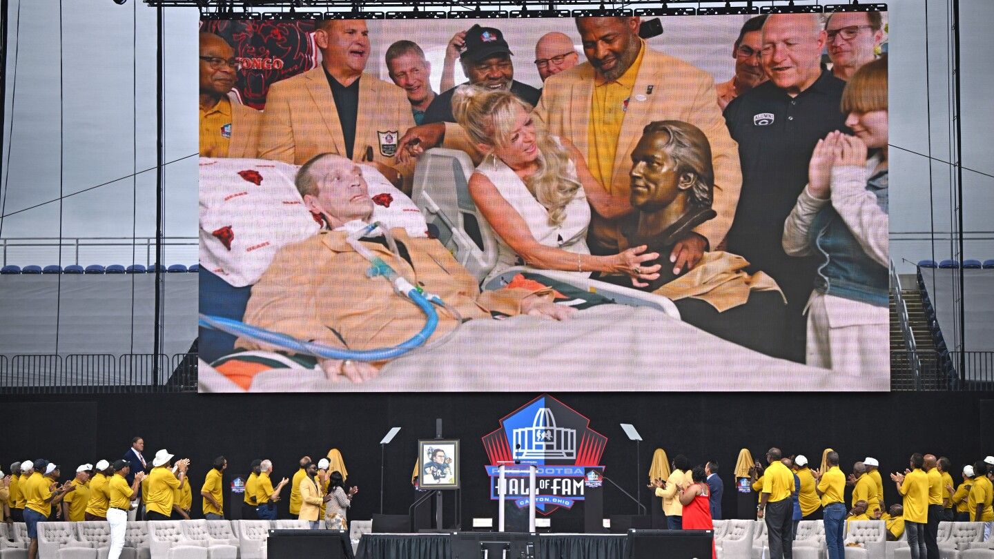 Steve 'Mongo' McMichael, who has ALS, enters the Pro Football Hall of Fame in ceremony at his home