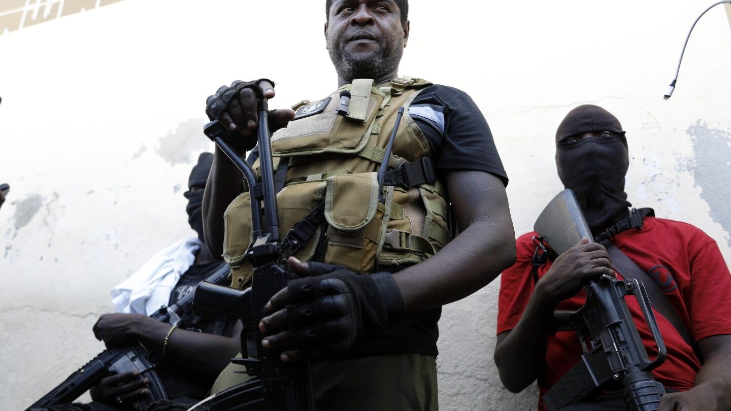 Haitian leader who was mysteriously absent arrives in Puerto Rico on his way home to quell violence