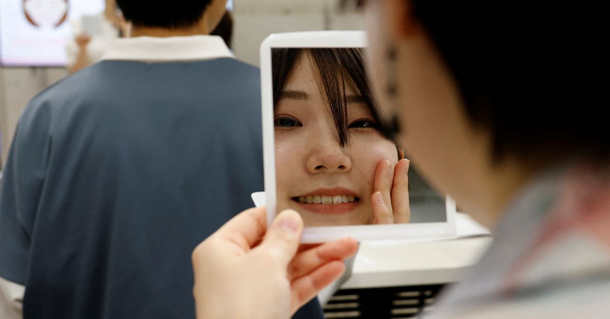 Japanese get trained in 'Hollywood' smiles as masks slowly come off