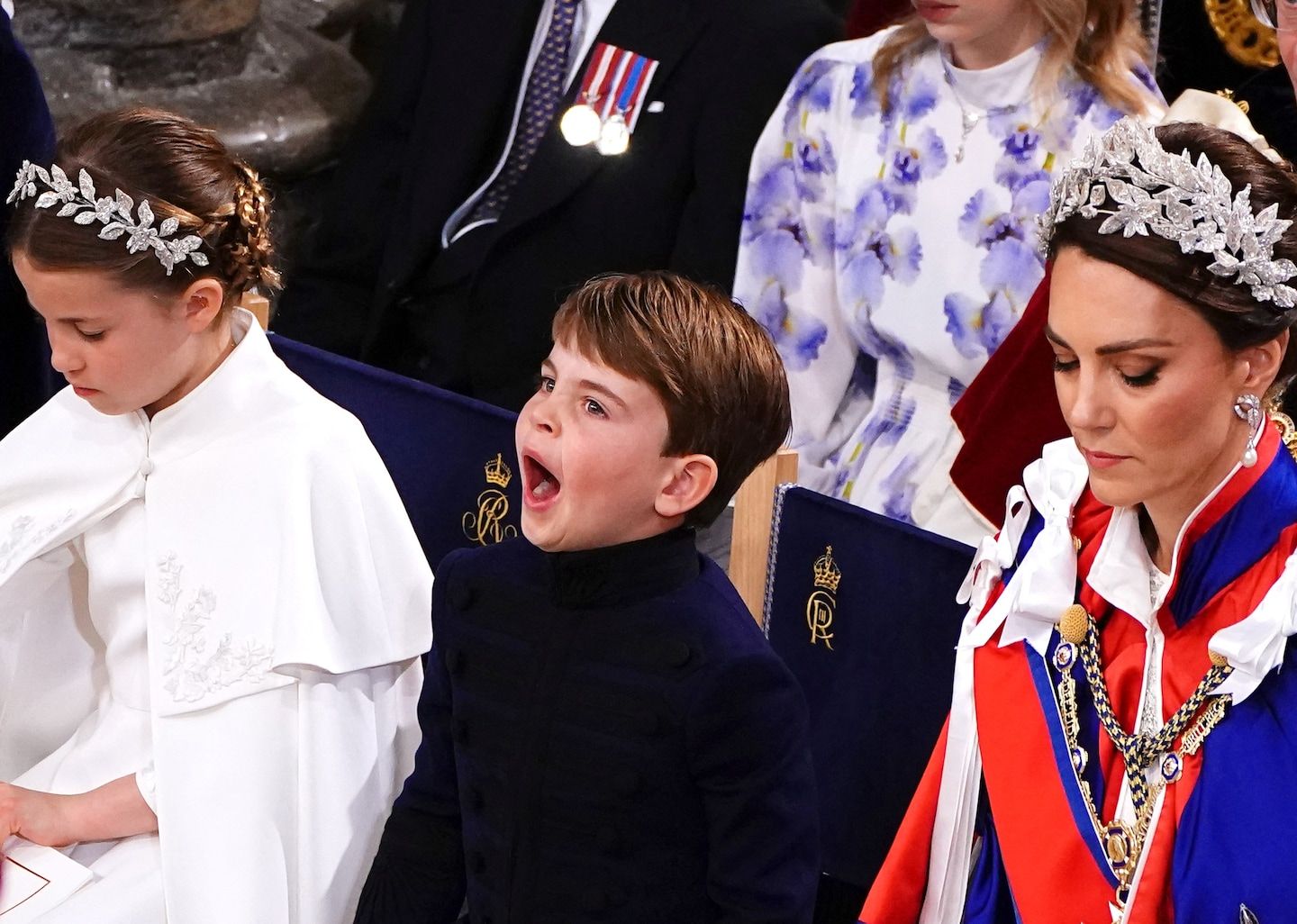 At king’s coronation, royal grandchildren charm audiences with yawns, waves