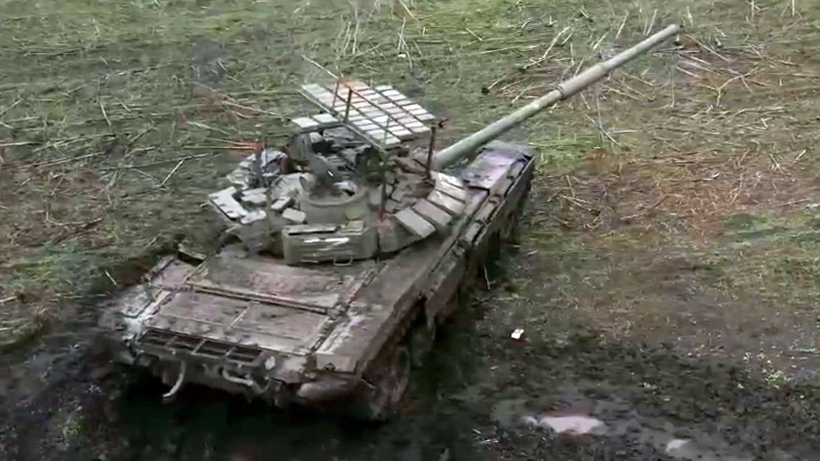 Russian Tank With ‘Cope Cage’ Covered In Explosive Reactive Armor Emerges