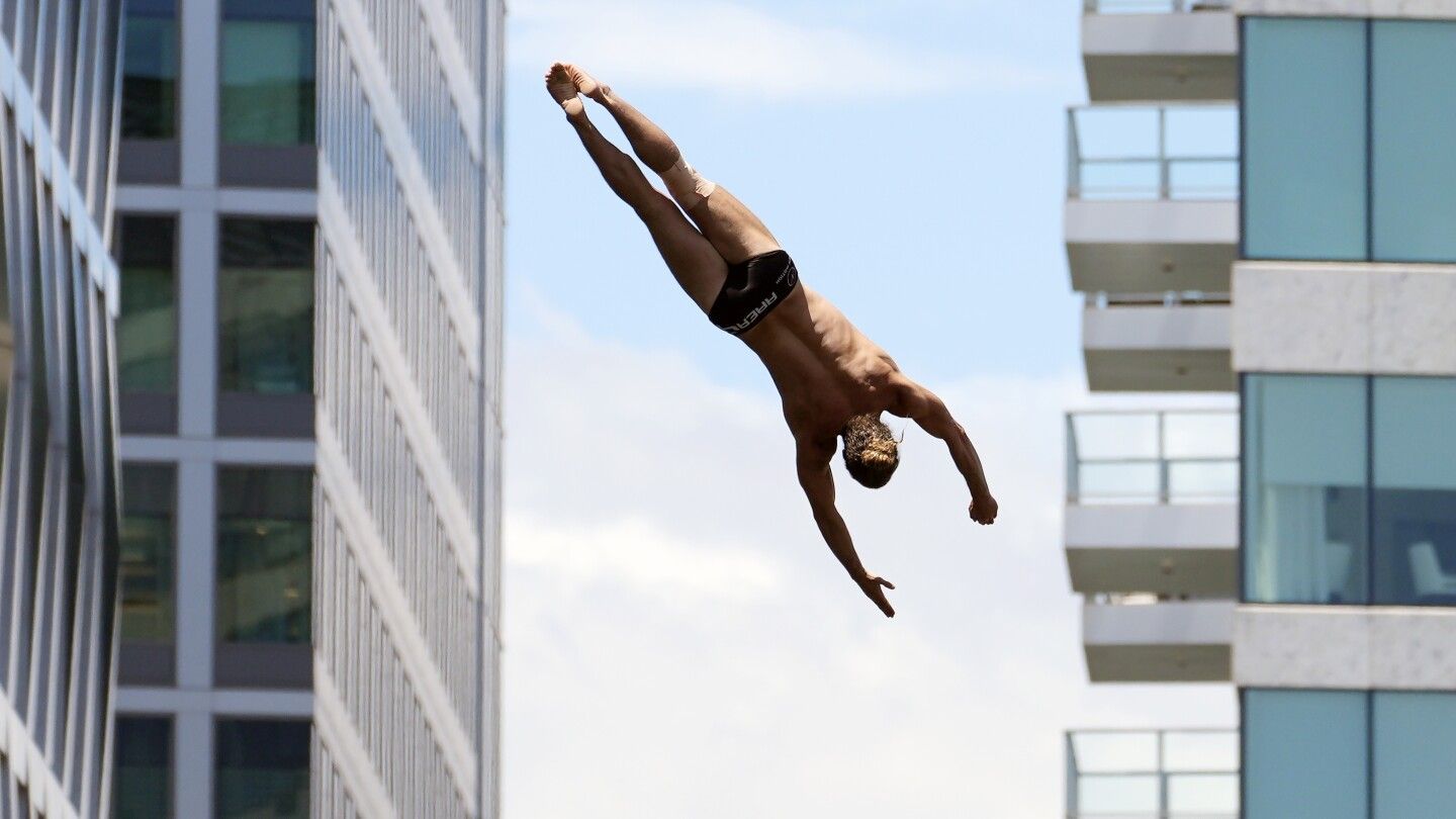 They're on the edge of glory, and the edge of an art museum, as cliff divers come to Boston