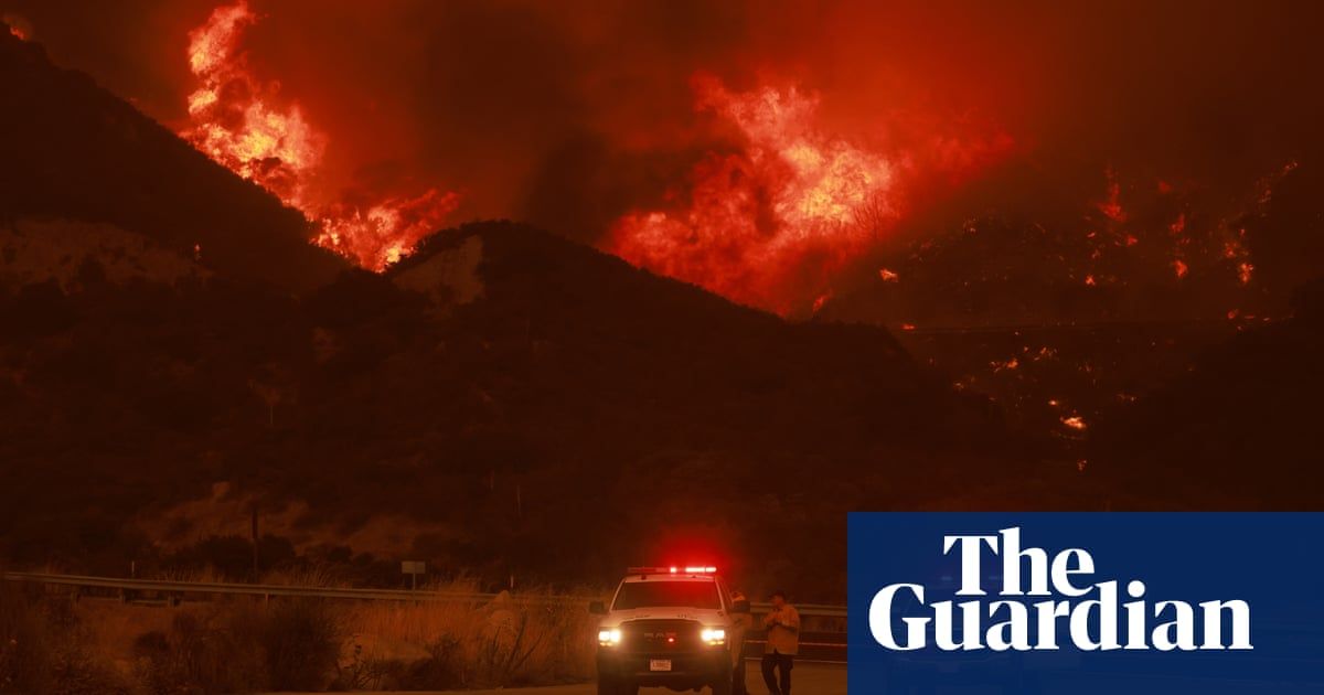 Wildfire near LA forces evacuations and threatens tens of thousands of buildings