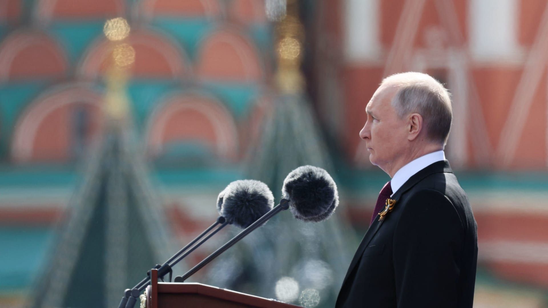 Photos show Putin watching on during annual parade