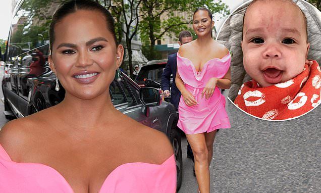 Chrissy Teigen channels Barbie in bubble gum pink mini dress