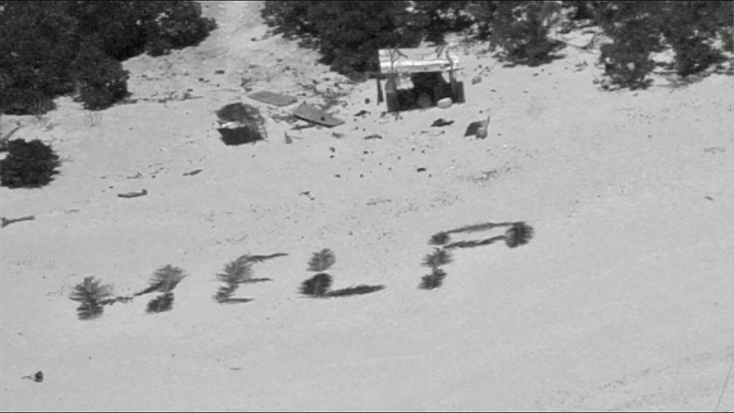 ‘HELP’ sign on beach points rescuers to men stuck nine days on remote Pacific atoll