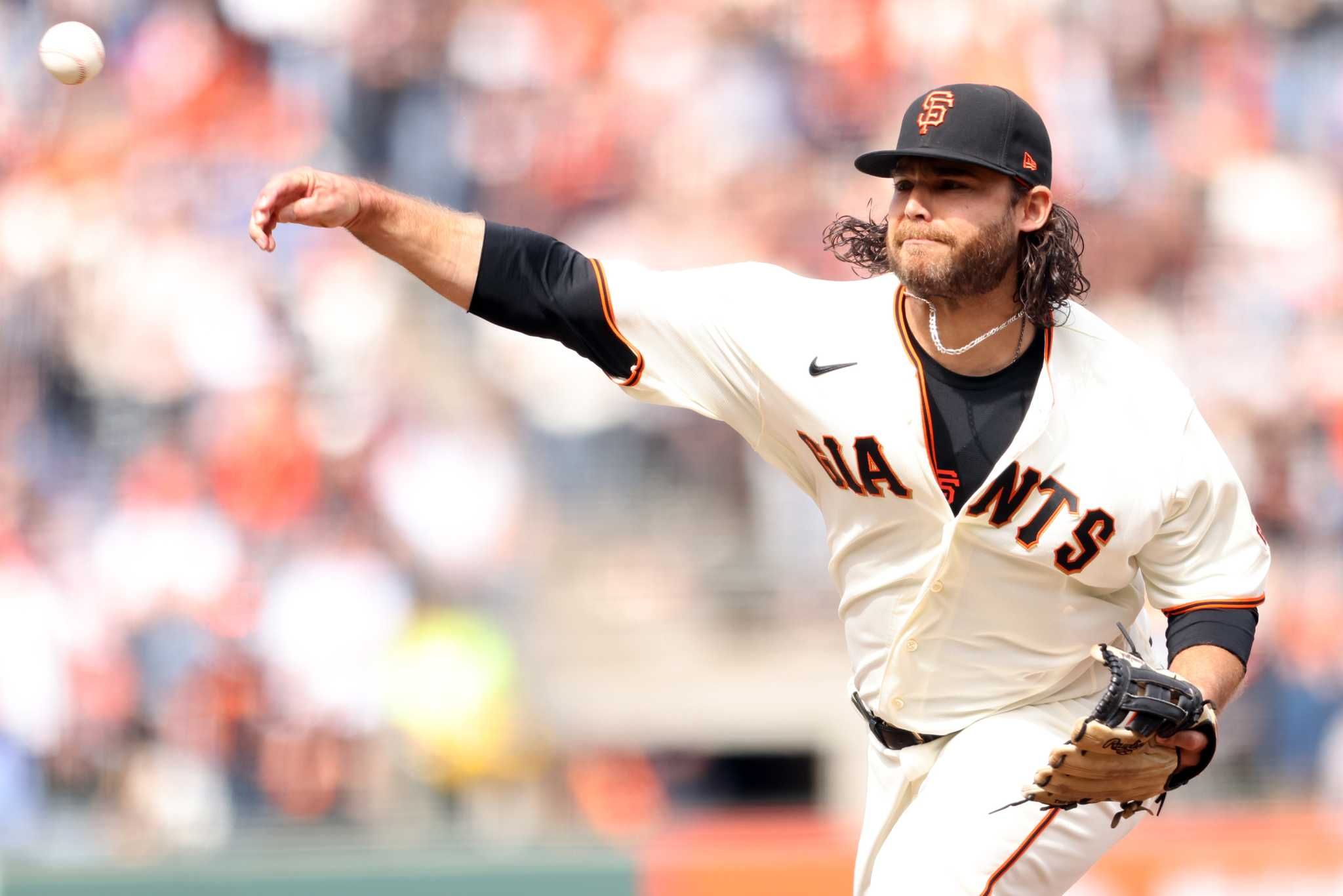 Giants' Brandon Crawford celebrates his 0.00 ERA after pitching debut