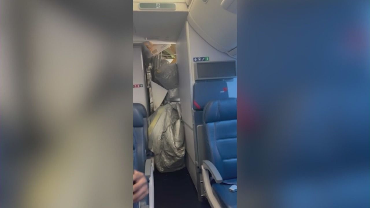 Emergency slide deployed inside Delta flight injures crew member