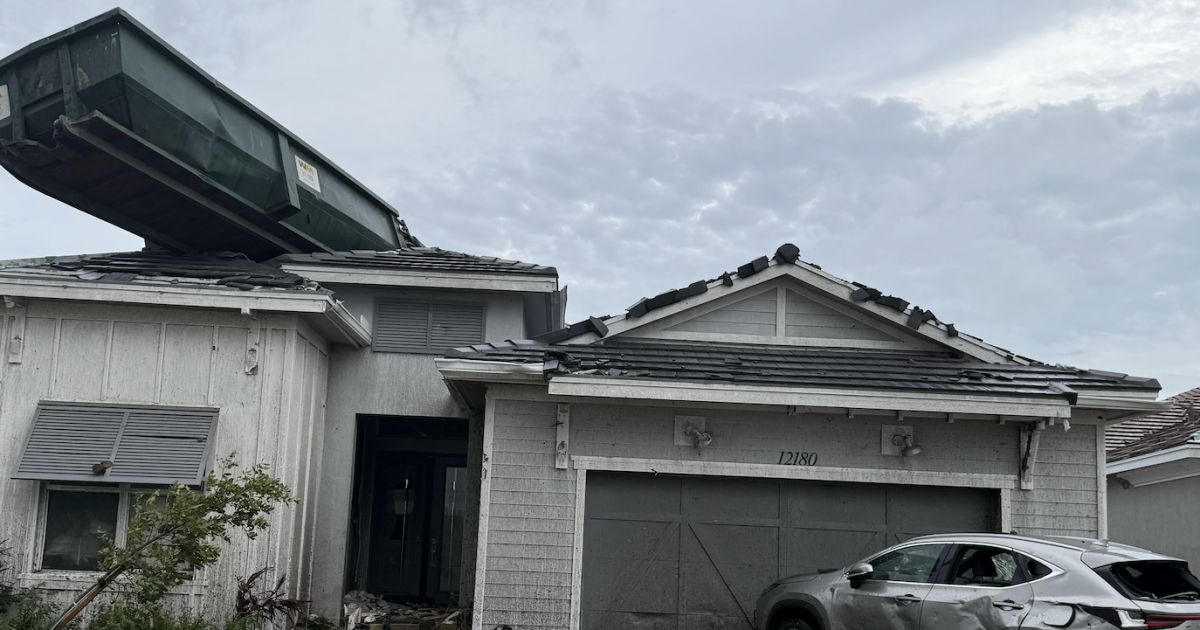 Resident describes having dumpster land on his roof