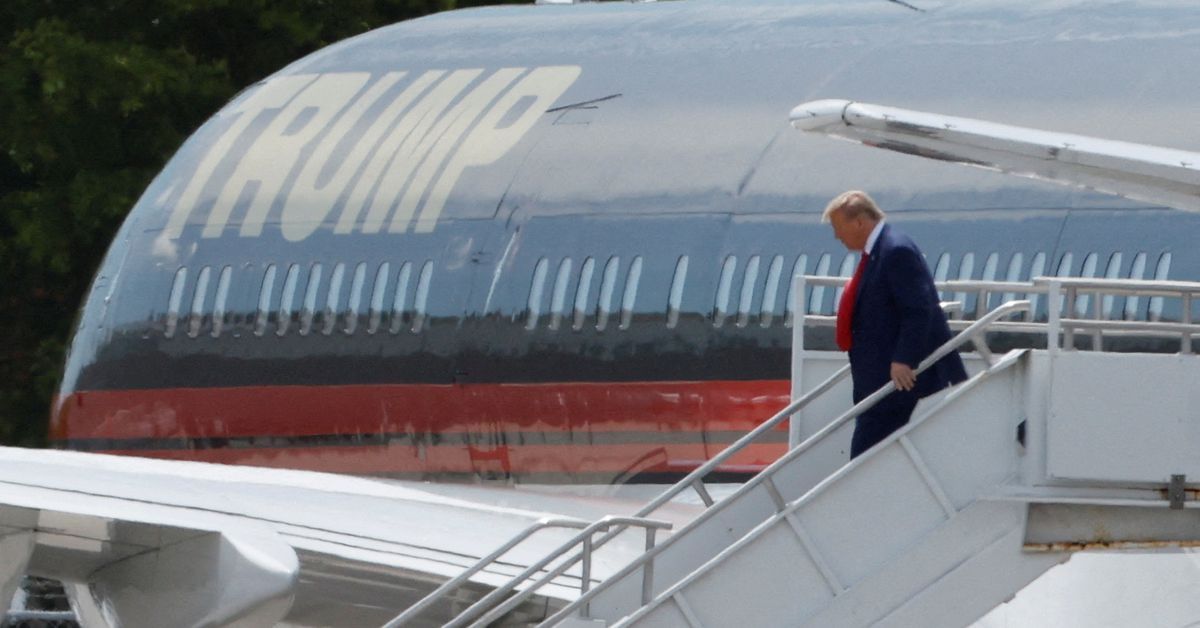 Trump arrives in Florida to face charges, maintains lead in poll