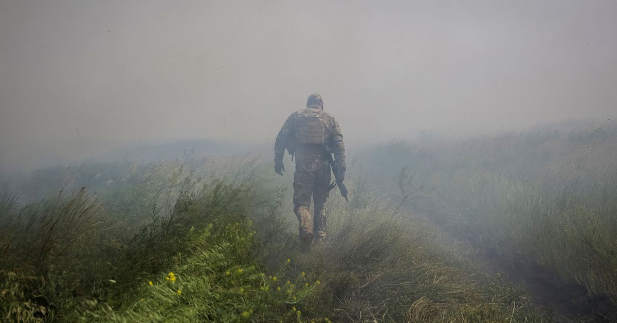 Blue and yellow flag, Russian dead attest to Ukrainian advance in south