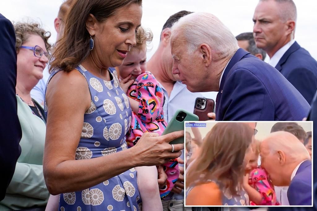 Joe Biden "creepily" nibbles child's shoulder in Finland