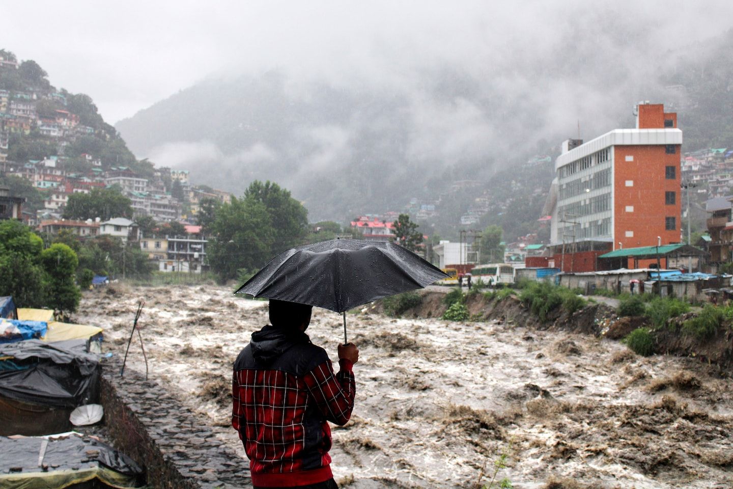 At least 100 dead in northern India after extreme monsoon flooding