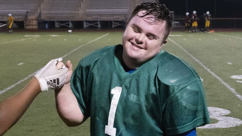 Caden Cox: The first known player with Down syndrome to play in a college football game is suing his alma mater over alleged discrimination