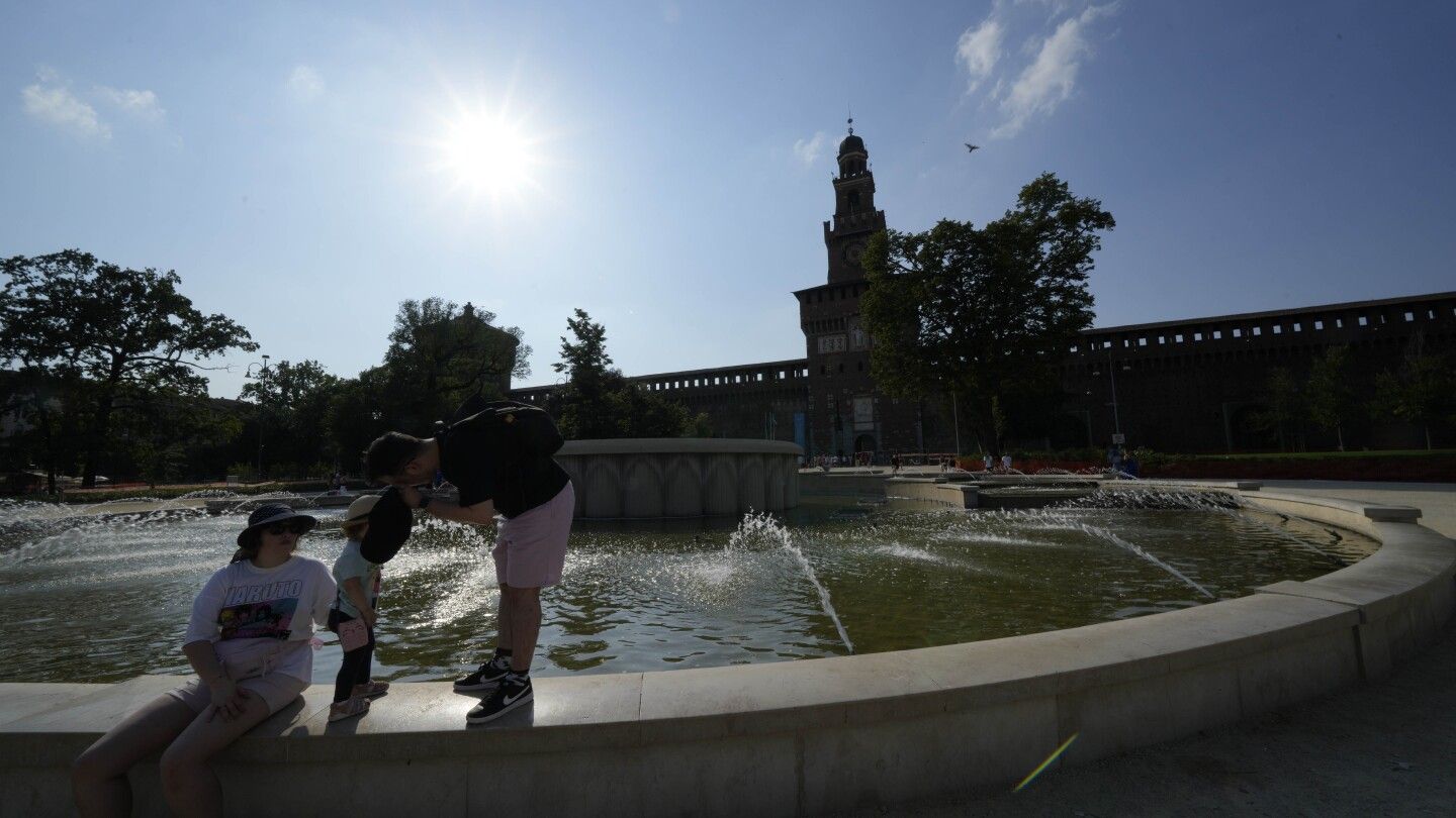 People and pets seek shade and cool as Europe sizzles under heat wave that's only going to get worse