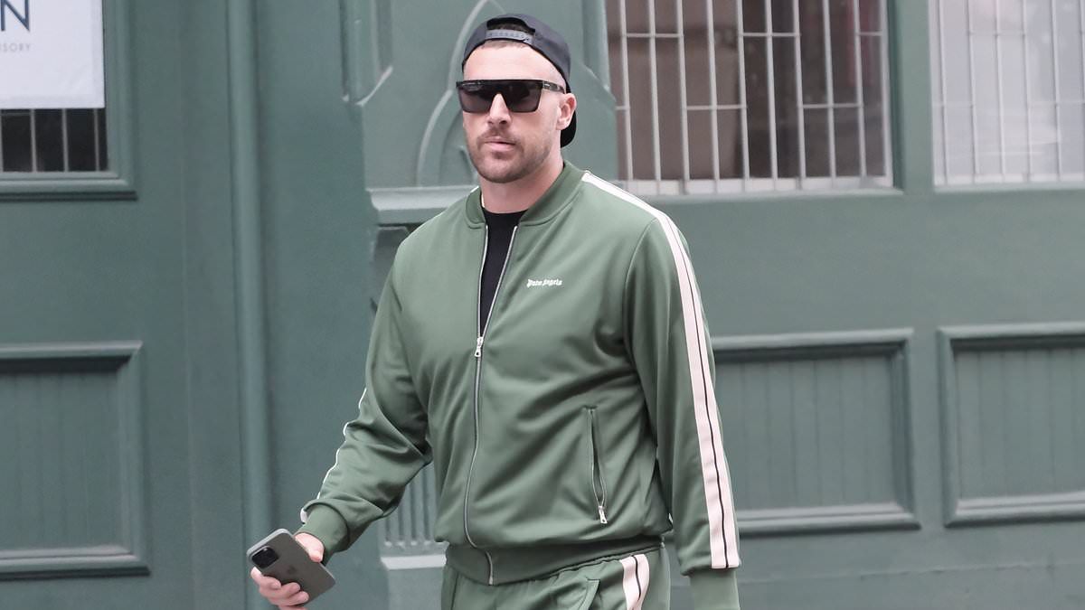 EXCLUSIVE: Travis Kelce is spotted leaving Taylor Swift's Tribeca apartment in green Palm Angels tracksuit... as loved-up pair opt against watching Chiefs star's brother Jason play at MetLife after ni