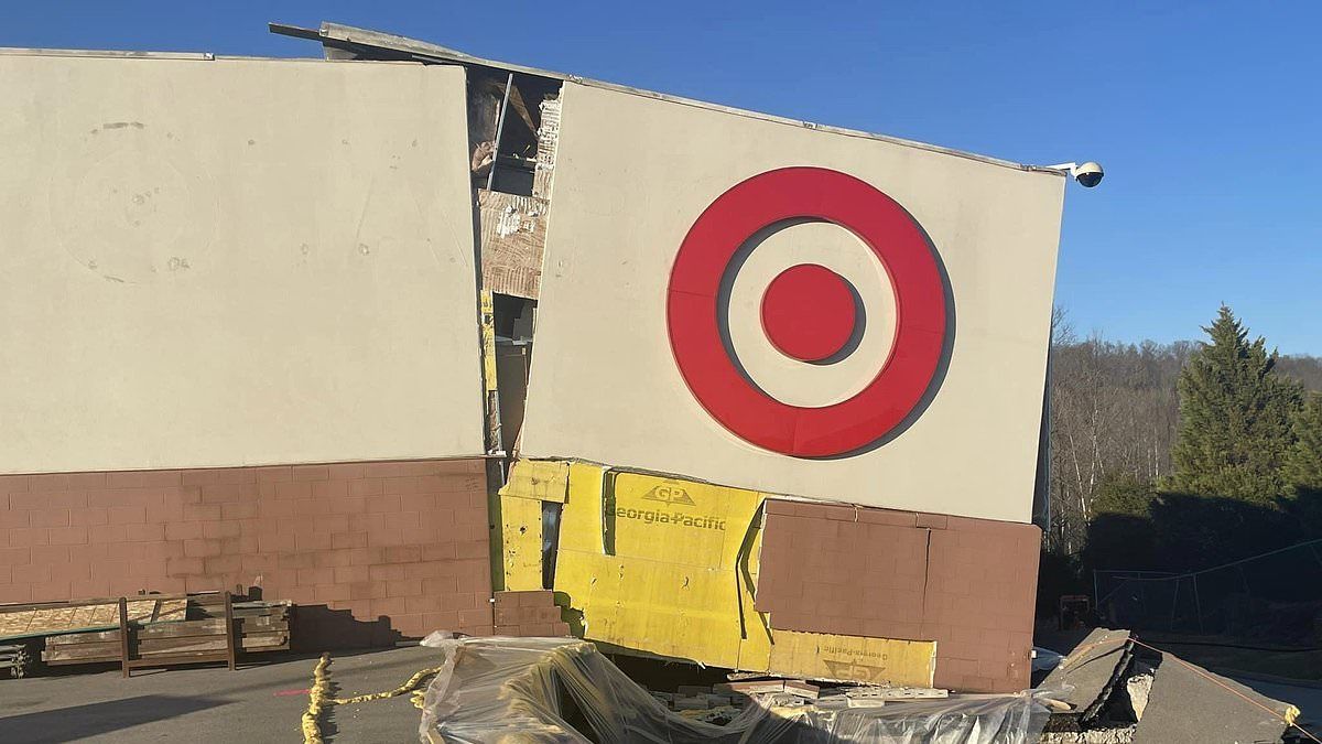 West Virginia Target closes after COLLAPSING on top of sliding ground as three families are forced to evacuate their homes near the crumbling hillside