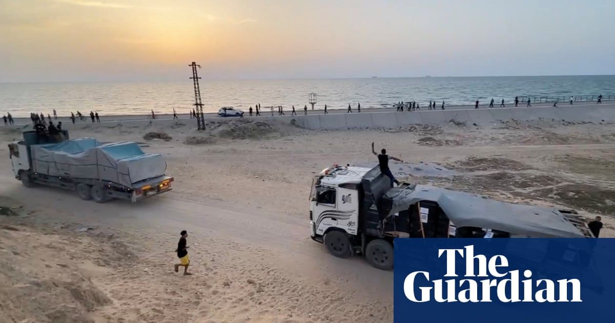 Aid arriving in Gaza via US-made pier but distribution blocked, says US aid chief