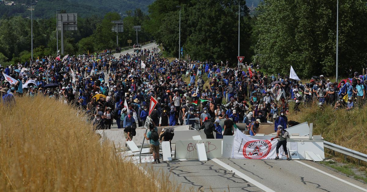 A dozen French police wounded in clashes with protesters opposing rail link in Alps