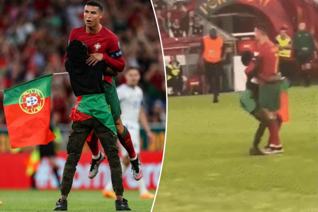 Cristiano Ronaldo lifted by fan who ran onto field during Portugal win