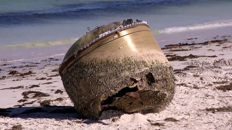 Mystery cylinder on Western Australia beach could be space junk, authorities say