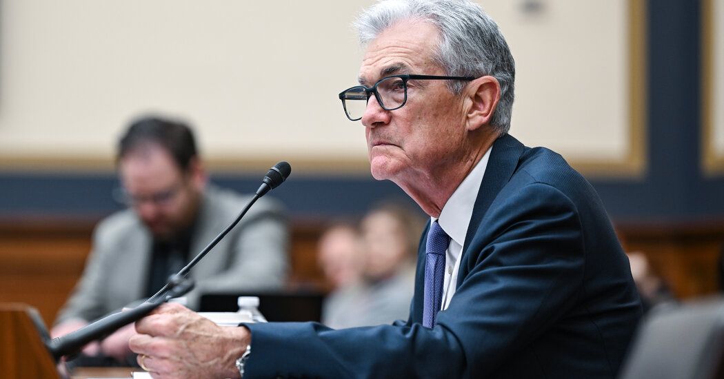 Fed Holds Rates Steady, Projects Three Cuts This Year