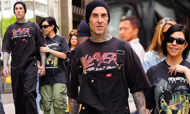 Kourtney Kardashian and Travis Barker seem very much in love as they stroll through New York