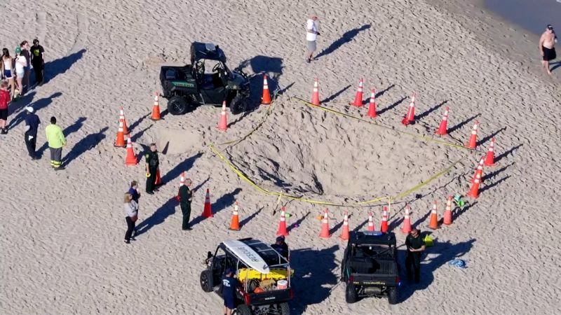 A 7-year-old girl died and a 9-year-old boy was hospitalized after being trapped in a sand hole collapse on a Florida beach