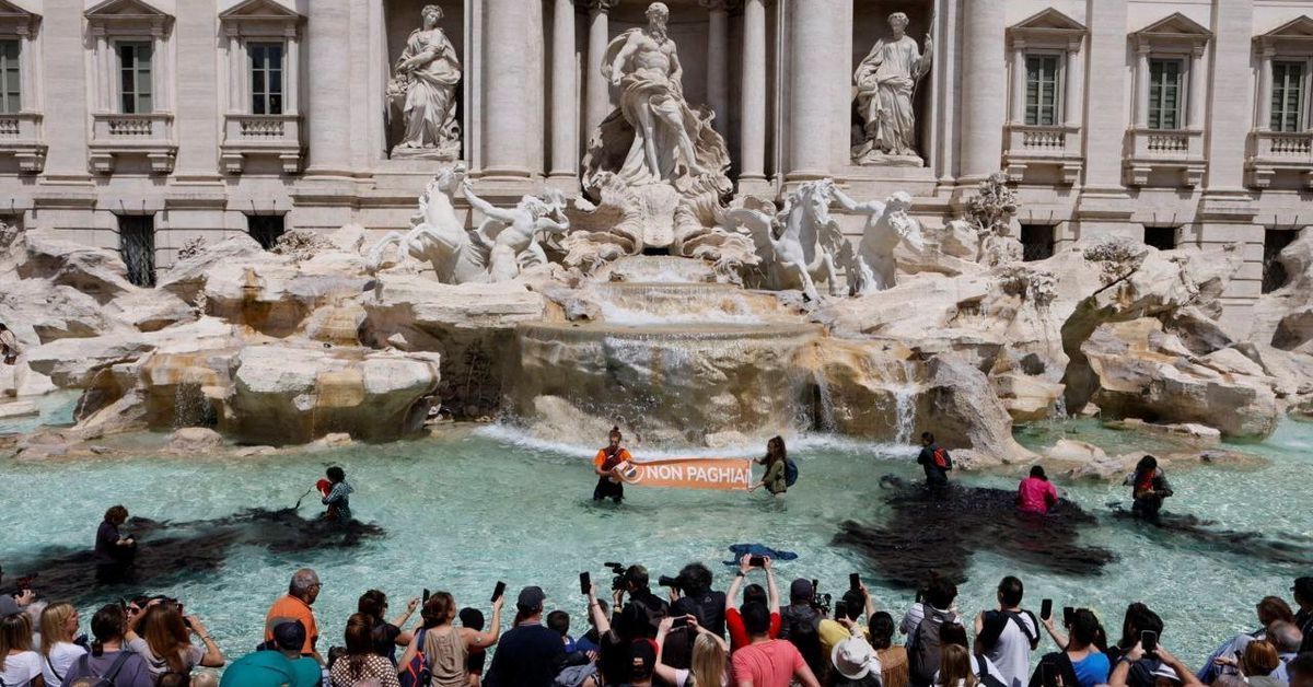 Trevi Fountain water turns black in Rome climate protest