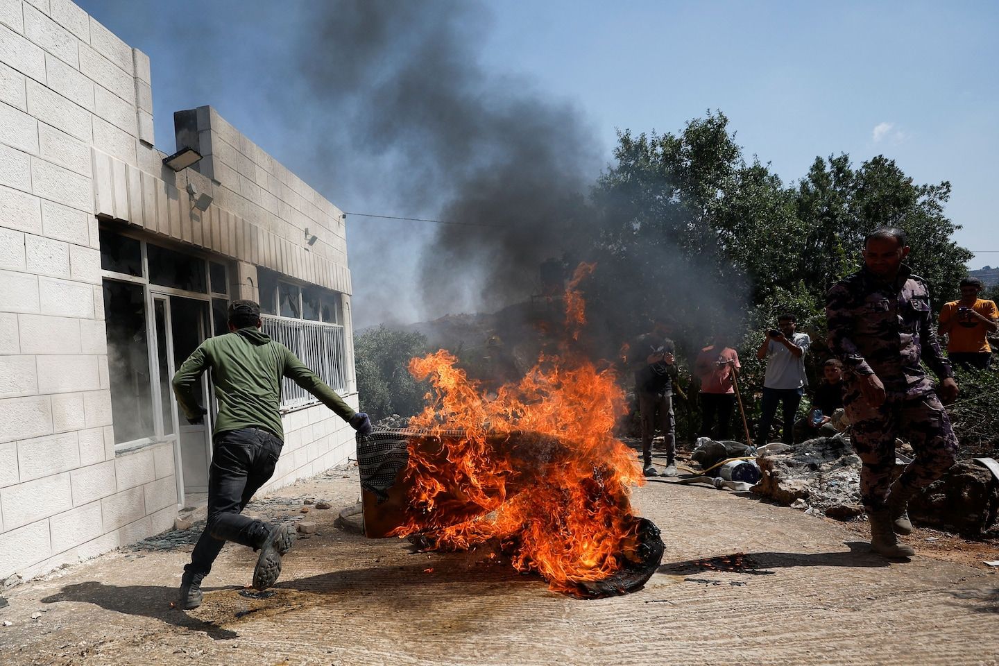 Israeli settlers rampage through Palestinian village after Hamas shooting