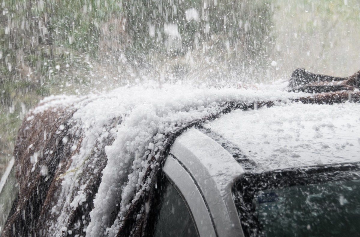 Freak hailstorm in Italy causes river of ice to roar down the main boulevard, injuring 100