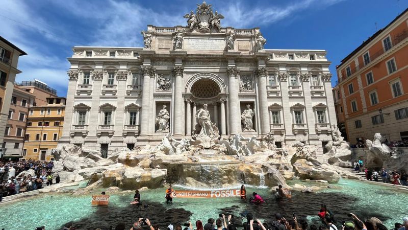 Trevi Fountain: Climate activists dump charcoal in Rome monument