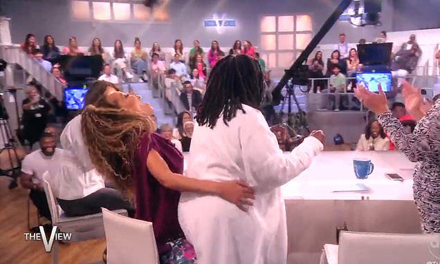 Whoopi Goldberg gives a lap dance to co-host Sunny Hostin midshow on The View