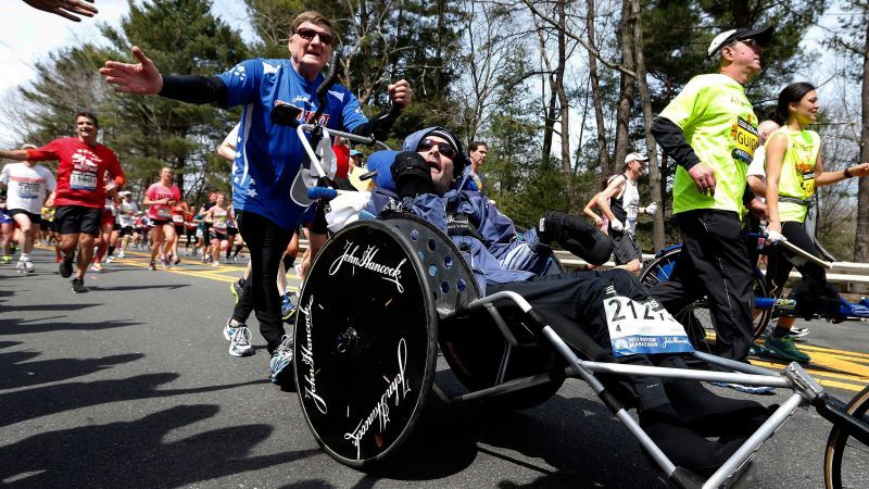 Rick Hoyt, whose late father pushed him through decades of Boston Marathons and other races, has died at 61