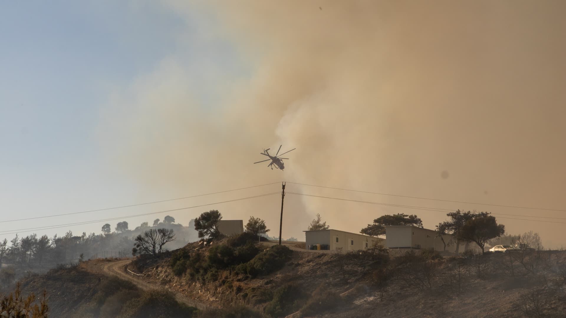 Tourists flee Greek island Rhodes wildfire, thousands evacuated