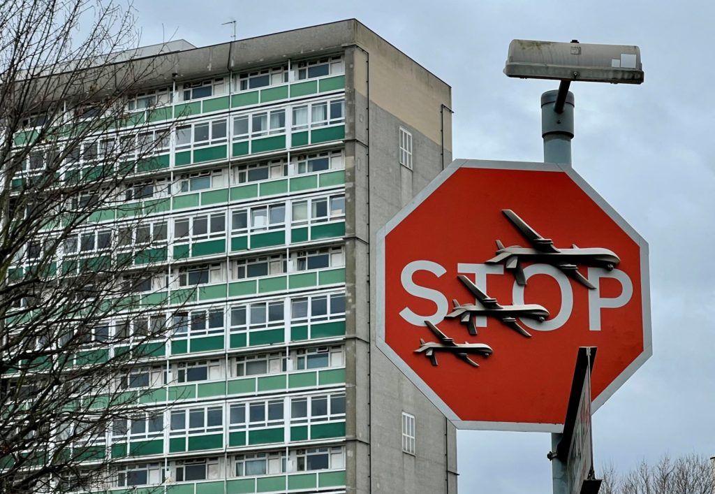 Suspect arrested in alleged theft of new Banksy art piece featuring drones on a stop sign