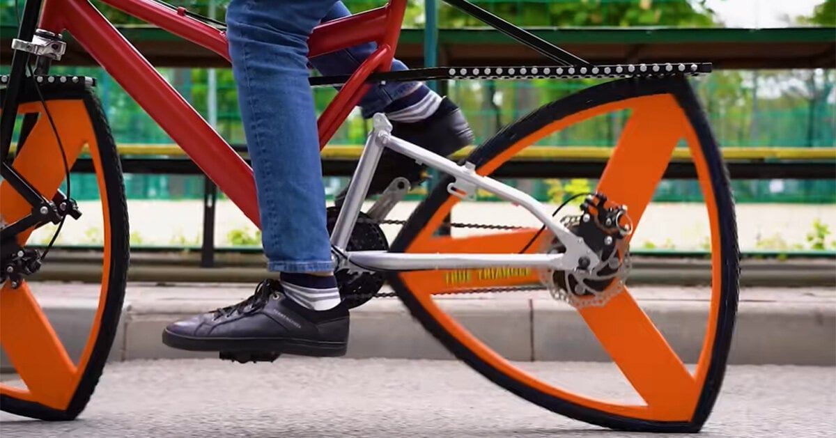 who said wheels have to be round? this triangle-wheeled bike is just as functional