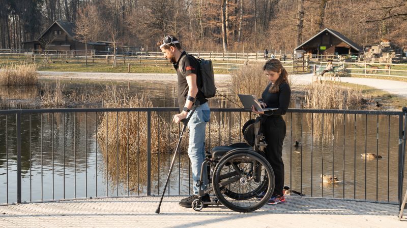 Man with paralysis walks naturally after brain, spine implants