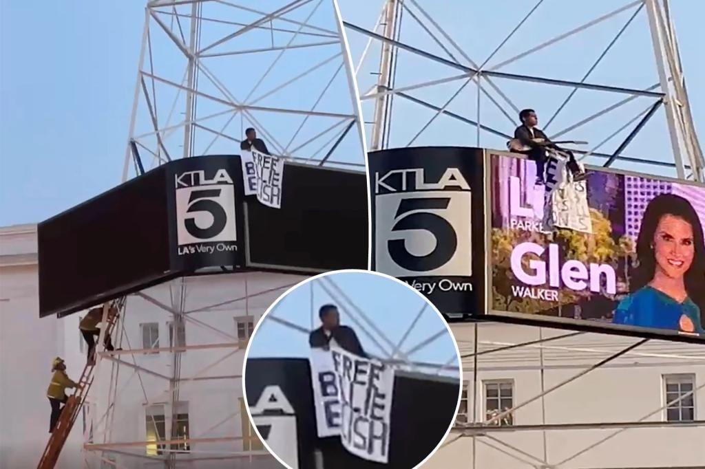 Man scales Hollywood's TV tower, waves 'Free Billie Eilish' sign