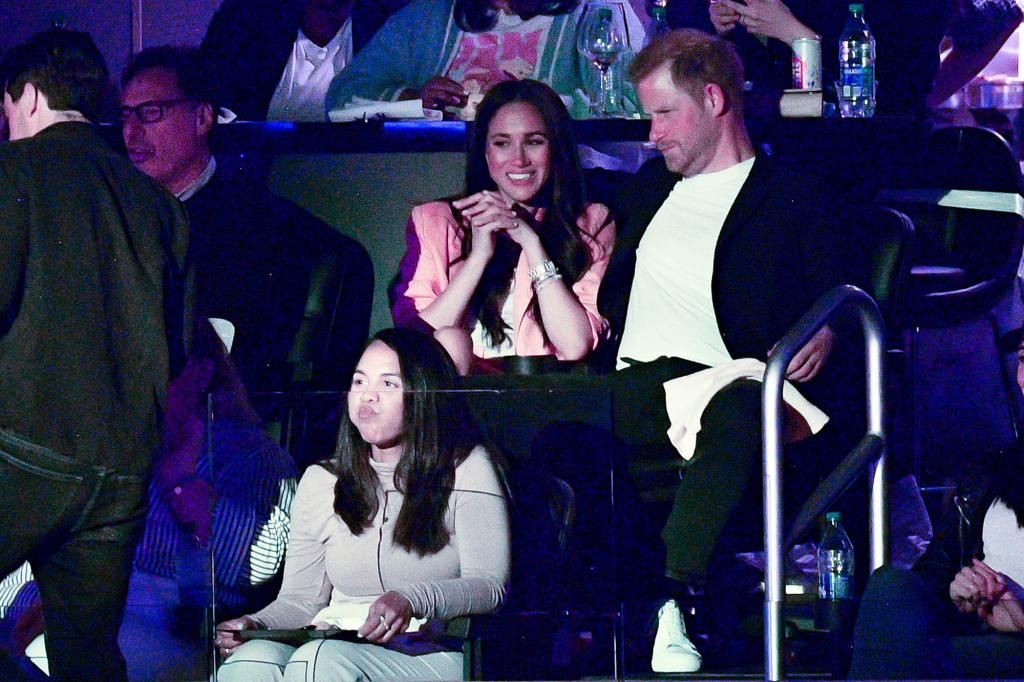 What Harry and Meghan whispered to each other at Lakers game: lip readers