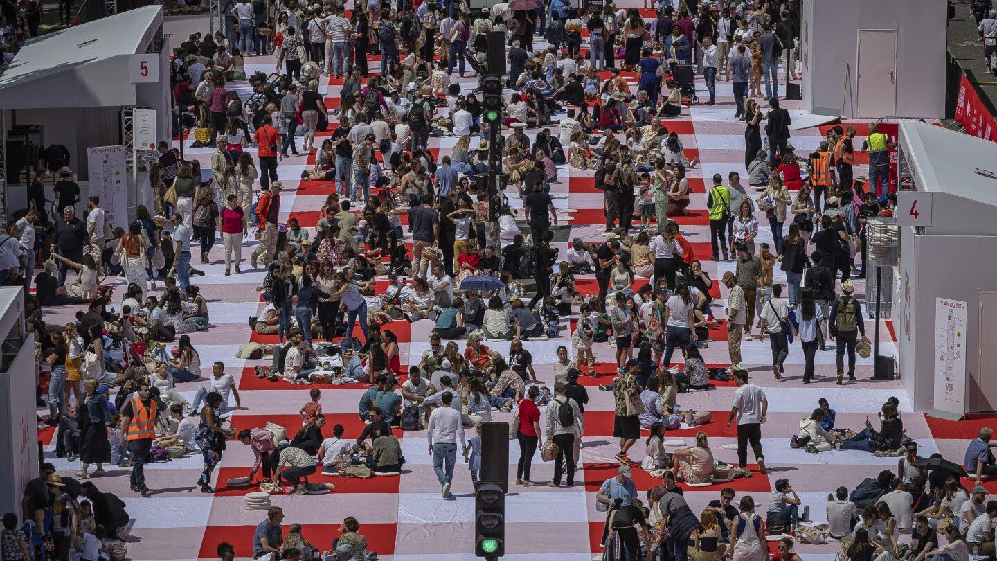 See how Paris' Champs-Elysees turned into a mass picnic blanket