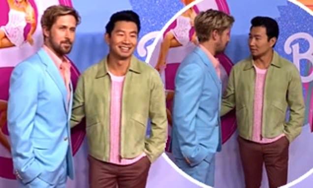 This Ken doesn't like to be touched! Ryan Gosling awkwardly brushes off Barbie co-star Simu Liu while posing on the pink carpet